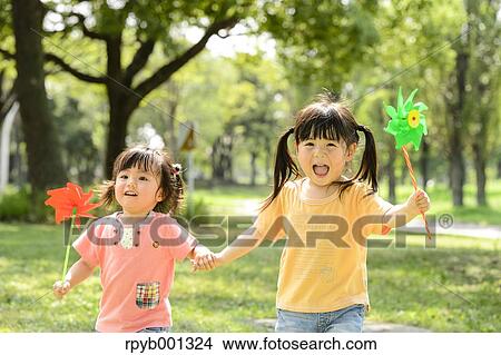 Kids playing in a park View Large Photo Image Picture - Kids playing in a park. Fotosearch