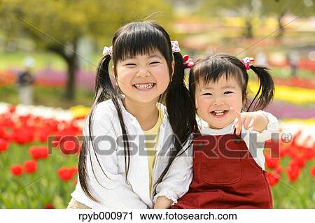 Kids playing in a park View Large Photo Image Stock Image - Kids playing in a park. Fotosearch