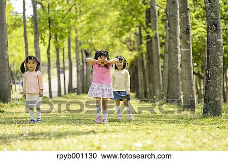 Kids playing in a park View Large Photo Image Stock Image - Kids playing in a park. Fotosearch