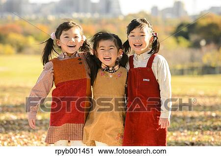 Kids playing in a park View Large Photo Image Stock Image - Kids playing in a park. Fotosearch