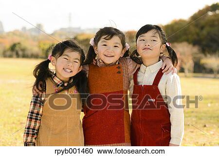 Kids playing in a park View Large Photo Image Stock Image - Kids playing in a park. Fotosearch