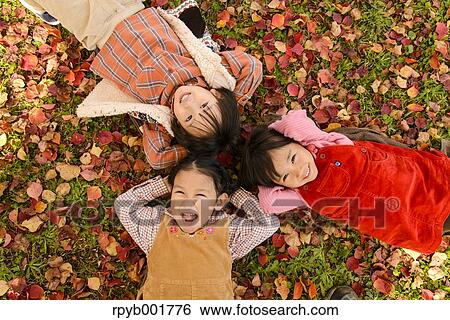 Kids playing in a park View Large Photo Image Stock Photograph - Kids playing in a park. Fotosearch