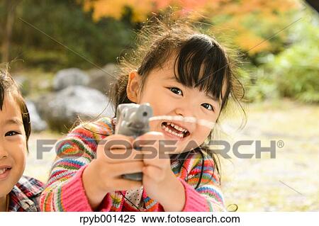 Kids playing in a park View Large Photo Image Stock Photography - Kids playing in a park. Fotosearch
