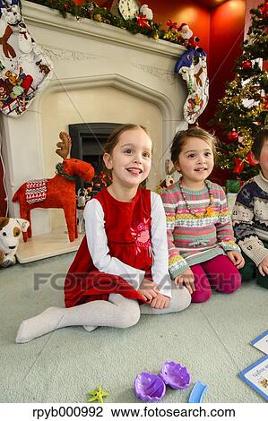 Kids playing in the house at Christmas View Large Photo Image Stock Image - Kids playing in the house at Christmas. Fotosearch