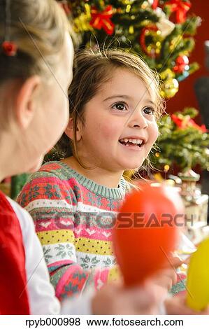 Kids playing in the house at Christmas View Large Photo Image Stock Photo - Kids playing in the house at Christmas. Fotosearch