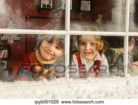 Kids playing in the house at Christmas View Large Photo Image Stock Photo - Kids playing in the house at Christmas. Fotosearch