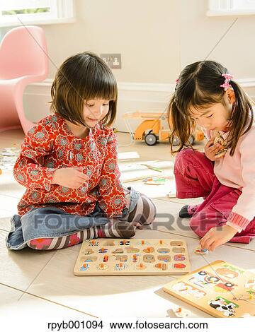 Kids playing in the house View Large Photo Image Picture - Kids playing in the house. Fotosearch