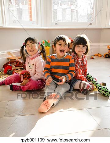 Kids playing in the house View Large Photo Image Stock Photo - Kids playing in the house. Fotosearch
