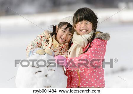 Kids playing in the snow View Large Photo Image Picture - Kids playing in the snow. Fotosearch