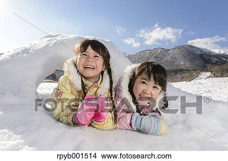 Picture - Kids playing in the snow. Fotosearch