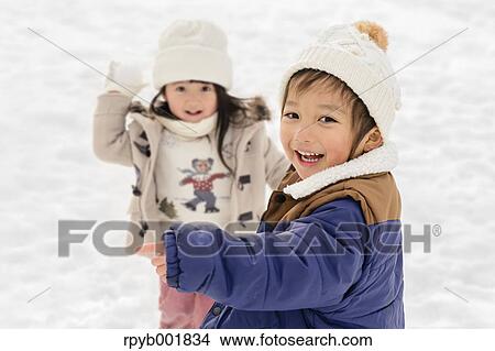 Kids playing in the snow View Large Photo Image Picture - Kids playing in the snow. Fotosearch