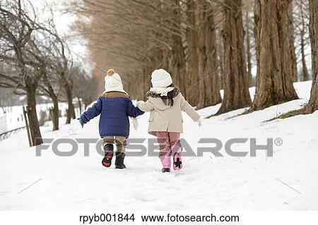 Kids playing in the snow View Large Photo Image Picture - Kids playing in the snow. Fotosearch