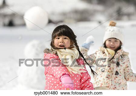 Kids playing in the snow View Large Photo Image Stock Image - Kids playing in the snow. Fotosearch
