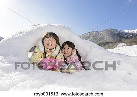 Kids playing in the snow View Large Photo Image Stock Image - Kids playing in the snow. Fotosearch