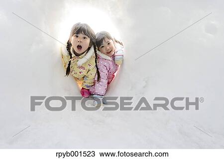 Kids playing in the snow View Large Photo Image Stock Image - Kids playing in the snow. Fotosearch