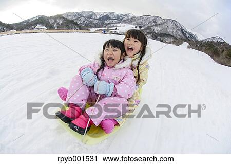 Kids playing in the snow View Large Photo Image Stock Image - Kids playing in the snow. Fotosearch