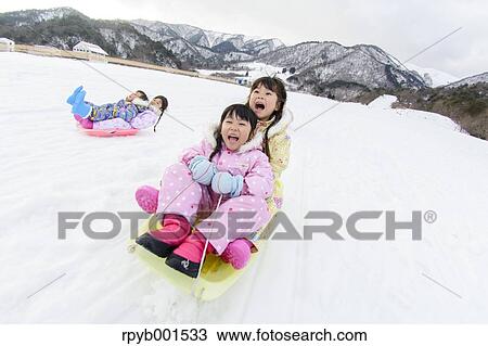 Kids playing in the snow View Large Photo Image Stock Image - Kids playing in the snow. Fotosearch