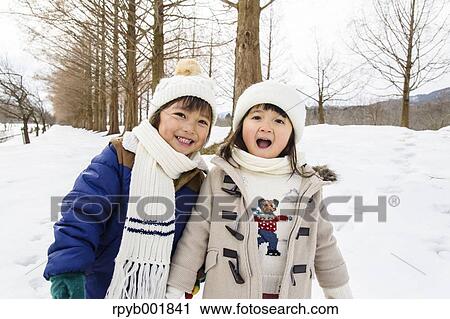 Kids playing in the snow View Large Photo Image Stock Image - Kids playing in the snow. Fotosearch