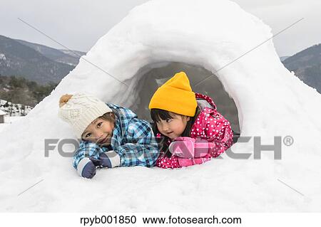 Kids playing in the snow View Large Photo Image Stock Image - Kids playing in the snow. Fotosearch