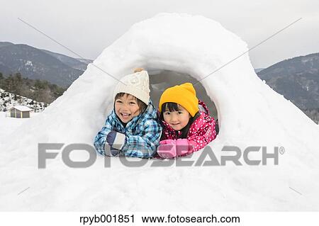 Kids playing in the snow View Large Photo Image Stock Image - Kids playing in the snow. Fotosearch