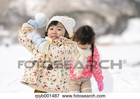 Kids playing in the snow View Large Photo Image Stock Photo - Kids playing in the snow. Fotosearch