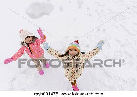 Kids playing in the snow View Large Photo Image Stock Photography - Kids playing in the snow. Fotosearch