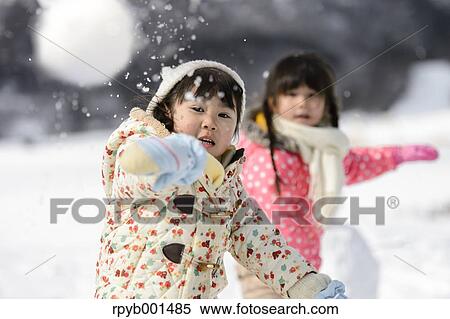 Kids playing in the snow View Large Photo Image Stock Photography - Kids playing in the snow. Fotosearch