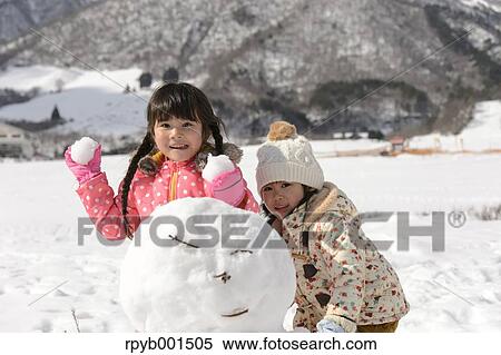 Kids playing in the snow View Large Photo Image Stock Photography - Kids playing in the snow. Fotosearch