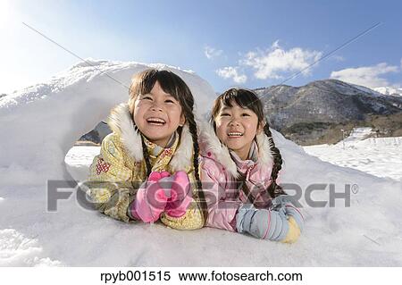 Kids playing in the snow View Large Photo Image Stock Photography - Kids playing in the snow. Fotosearch