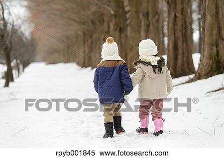Kids playing in the snow View Large Photo Image Stock Photography - Kids playing in the snow. Fotosearch