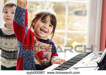 Kids playing piano View Large Photo Image Stock Photo - Kids playing piano. Fotosearch
