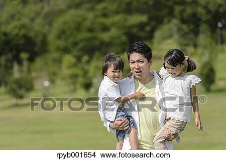 Kids with dad at the park View Large Photo Image Picture - Kids with dad at the park. Fotosearch