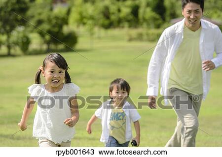 Kids with dad at the park View Large Photo Image Stock Image - Kids with dad at the park. Fotosearch