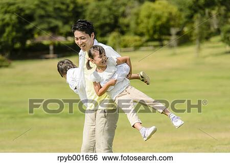 Kids with dad at the park View Large Photo Image Stock Photograph - Kids with dad at the park. Fotosearch