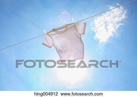 Laundry hanging against blue sky View Large Photo Image Stock Image - Laundry hanging against blue sky. Fotosearch