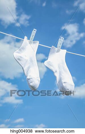Laundry hanging against blue sky View Large Photo Image Stock Photo - Laundry hanging against blue sky. Fotosearch
