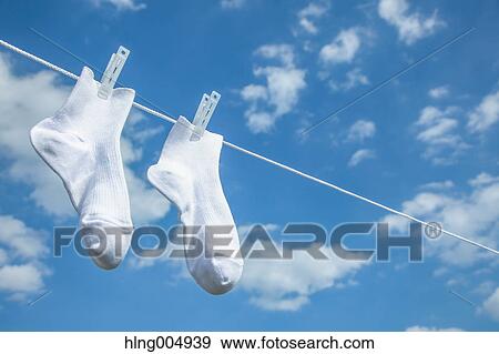 Laundry hanging against blue sky View Large Photo Image Stock Photo - Laundry hanging against blue sky. Fotosearch