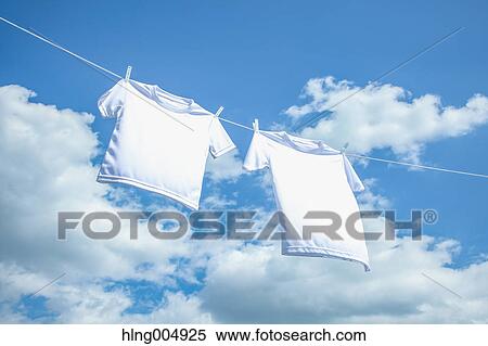 Stock Photography - Laundry hanging against blue sky. Fotosearch