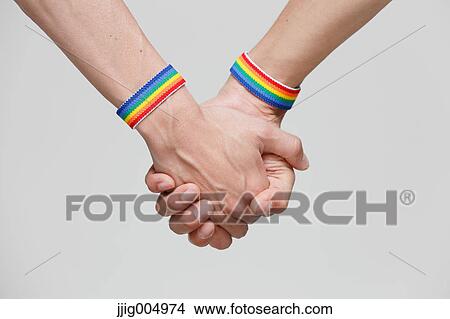 Male couple holding hands View Large Photo Image Picture - Male couple holding hands. Fotosearch
