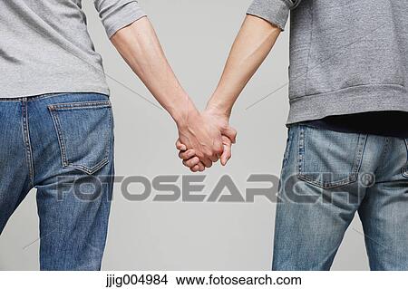 Male couple holding hands View Large Photo Image Picture - Male couple holding hands. Fotosearch