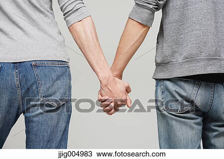 Male couple holding hands View Large Photo Image Stock Image - Male couple holding hands. Fotosearch