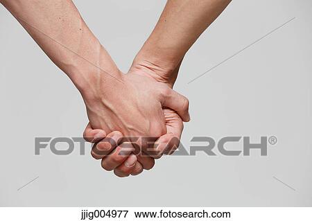 Male couple holding hands View Large Photo Image Stock Photo - Male couple holding hands. Fotosearch