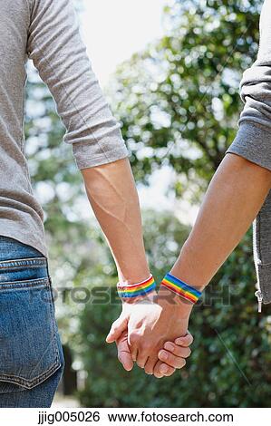 Male couple holding hands View Large Photo Image Stock Photograph - Male couple holding hands. Fotosearch