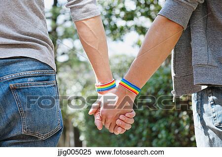 Male couple holding hands View Large Photo Image Stock Photography - Male couple holding hands. Fotosearch