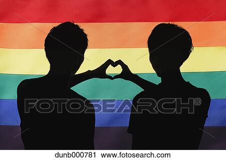 Male couple silhouette against rainbow flag View Large Photo Image Stock Image - Male couple silhouette against rainbow flag. Fotosearch