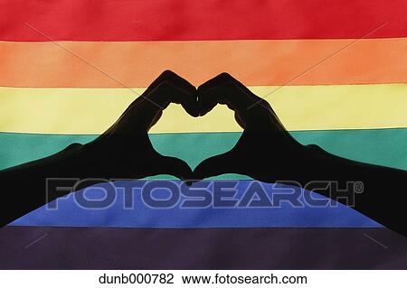 Male couple silhouette against rainbow flag View Large Photo Image Stock Image - Male couple silhouette against rainbow flag. Fotosearch