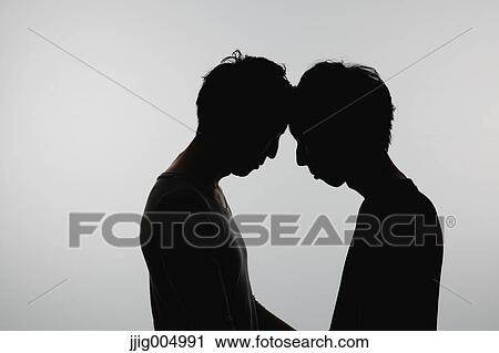 Male couple silhouette View Large Photo Image Stock Image - Male couple silhouette. Fotosearch