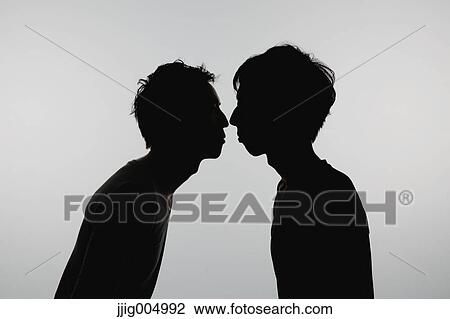 Male couple silhouette View Large Photo Image Stock Image - Male couple silhouette. Fotosearch