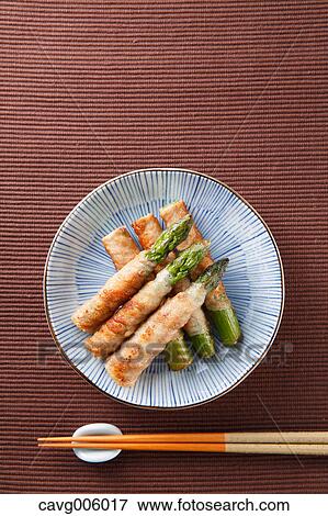 Stock Photo - Meat-rolled asparagus. Fotosearch