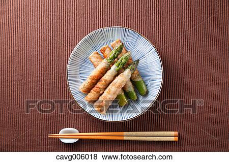 Stock Photo - Meat-rolled asparagus. Fotosearch